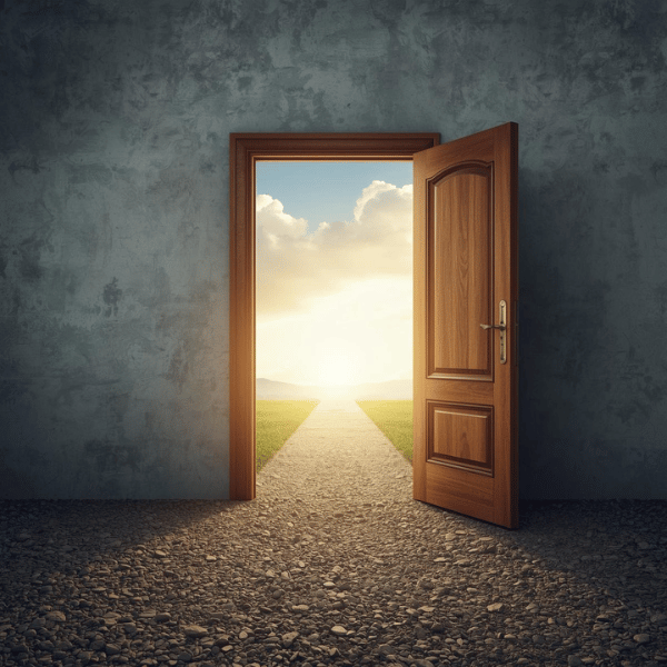 A wooden door in a gray, textured wall opens to reveal a bright, sunlit landscape with a dirt path, green grass, and a sky filled with soft clouds.